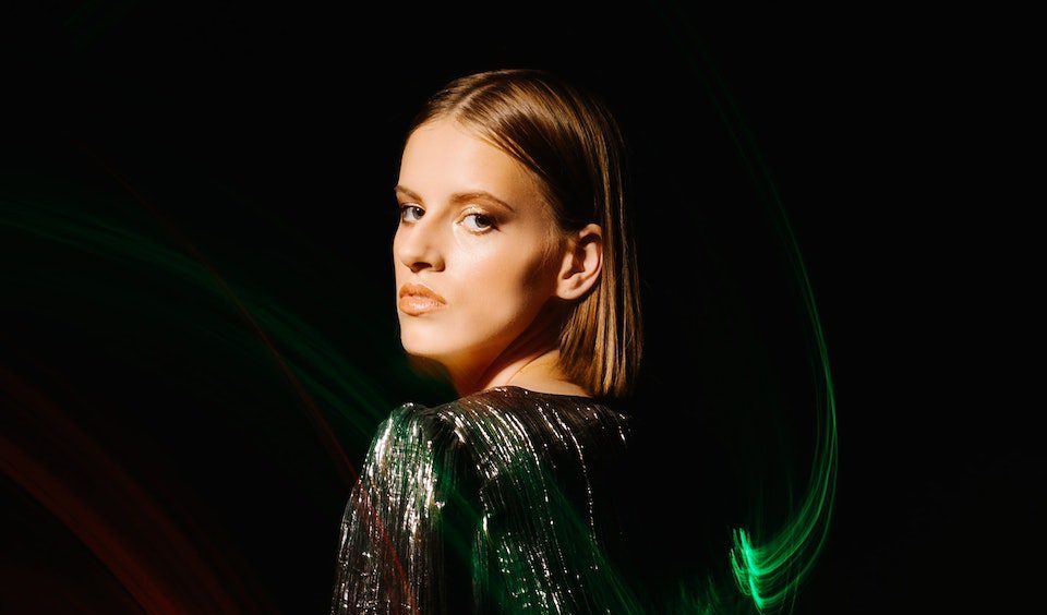 Woman Standing backside in a Studio and Lights